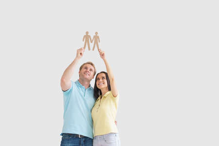 Young couple with cardboard objectsの写真素材