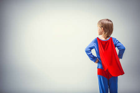 Little superman in a raincoatの写真素材