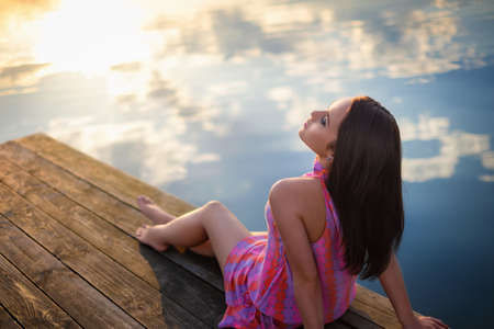 Attractive girl on the pierの写真素材