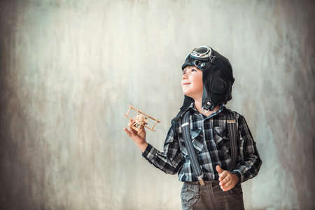 Little boy with airplane in the studioの写真素材