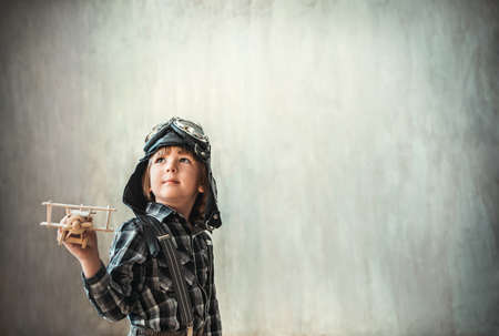 Little boy with airplane in the studioの写真素材