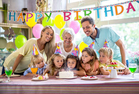 Families with a child at a birthday partyの写真素材