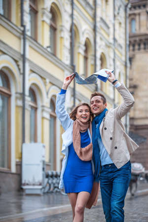 Young couple with a map on the streetの写真素材