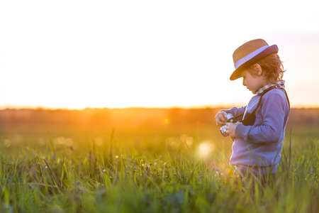 Photographer with camera in the fieldの写真素材