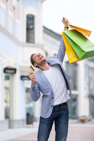Expression man with a credit cardの写真素材