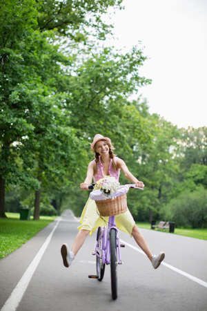 Young girl on a bicycle outdoorsの写真素材