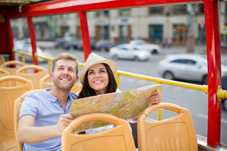 Young couple with a mapの写真素材