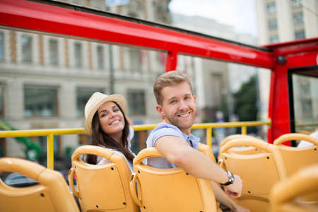 Young couple in the tour bus