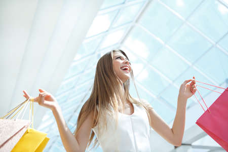 Happy woman with shopping bags