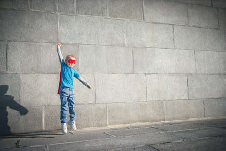 Jumping little boy outdoorsの写真素材
