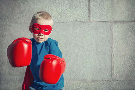 Little boy with boxing glovesの写真素材
