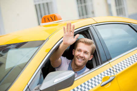 Young driver in a taxiの写真素材