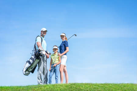 Happy family on the golf courseの写真素材