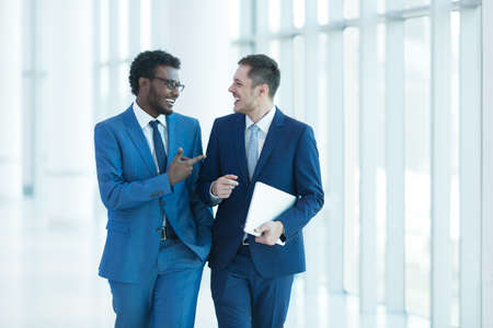 Smiling business partners in officeの写真素材