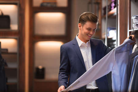 Young businessman in storeの写真素材