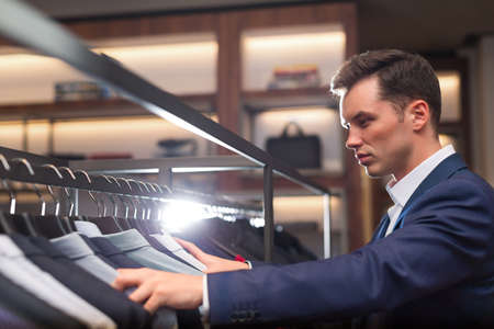 Young businessman in suit indoorsの写真素材