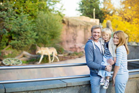 Family with little child in zooの写真素材