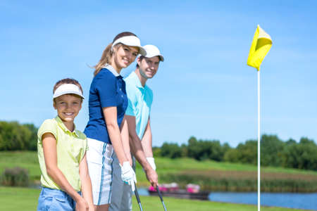Happy family on golf courseの写真素材
