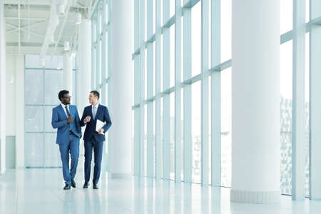 Young businessman in suit in officeの写真素材