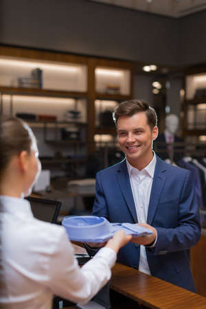 Young man at counterの写真素材