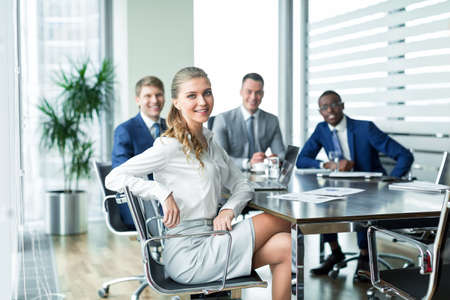 Smiling businesswoman at meetingの写真素材