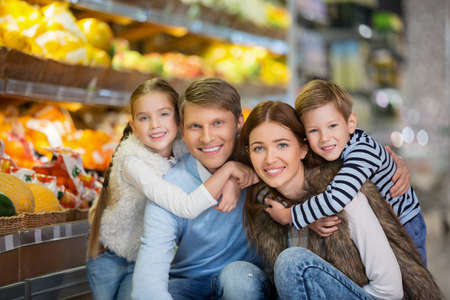 Smiling family in a storeの写真素材