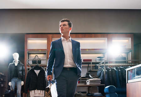 Young businessman in store