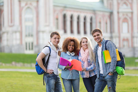 Smiling students on campus outdoorsの写真素材