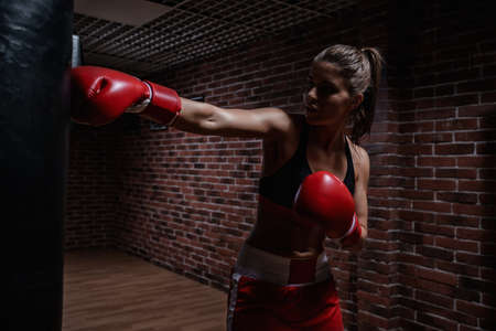Young woman in boxing ring