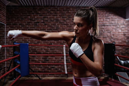 Young woman in boxing ringの写真素材