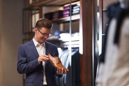 Smiling businessman in suit indoorsの写真素材