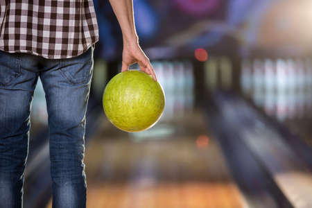 Man's hand with ball in bowlingの写真素材