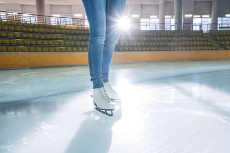 Female legs at skating rink