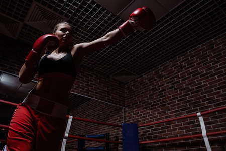 Young woman in boxing ringの写真素材