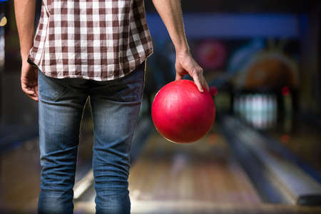 Man's hand with ball in bowlingの写真素材