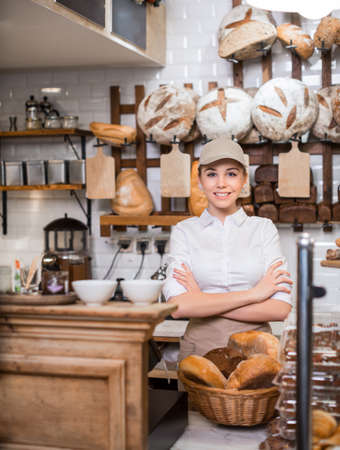Smiling baker at counter