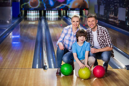Smiling family in bowlingの写真素材