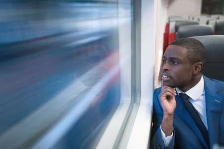 Young businessman in a trainの写真素材