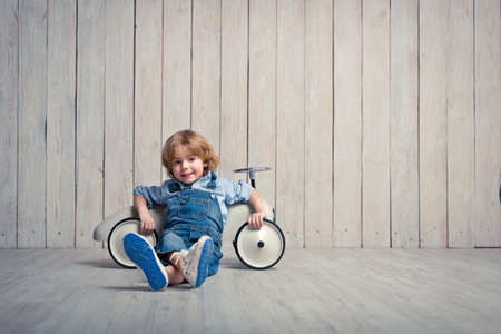 Little boy with car in studioの写真素材