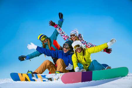 Young people with snowboards outdoorsの写真素材