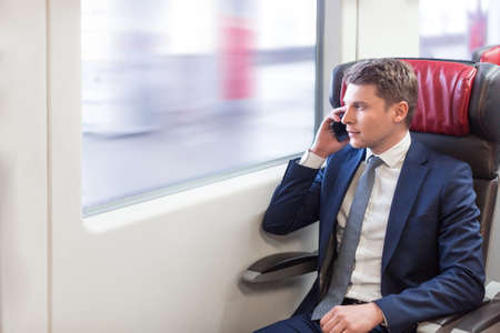 Young businessman with phoneの写真素材