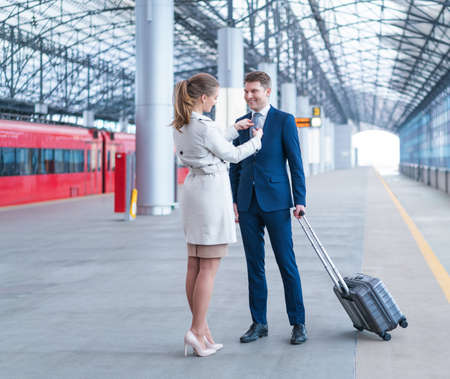 Smiling couple at the stationの写真素材