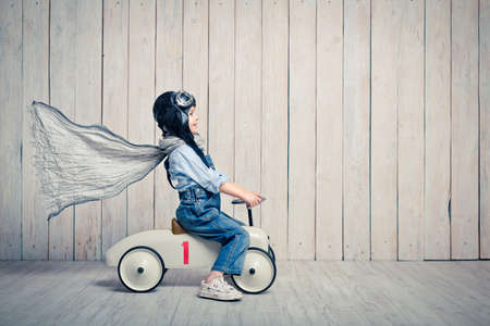 Little boy with a car in studioの写真素材