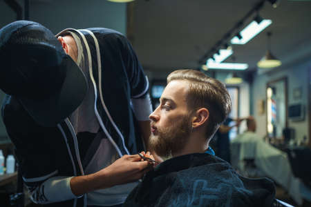 Bearded man in a barber shopの写真素材