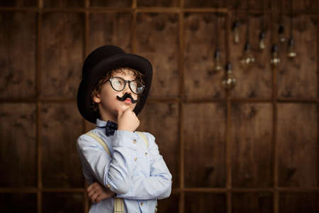 Thinking boy in studio