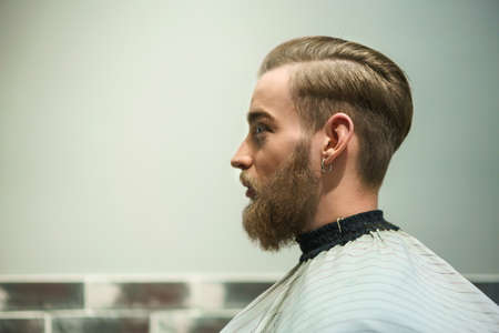 Attractive man in a barber shopの写真素材