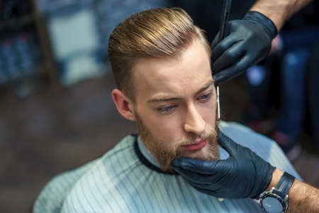 Young hipster in a barber shop