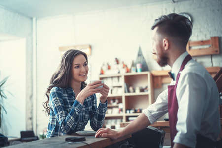 Smiling people in coffee shopの写真素材