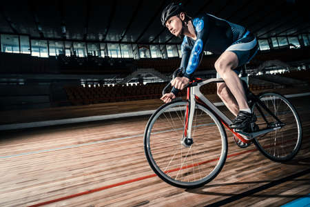 Racing cyclist on a cycle trackの写真素材
