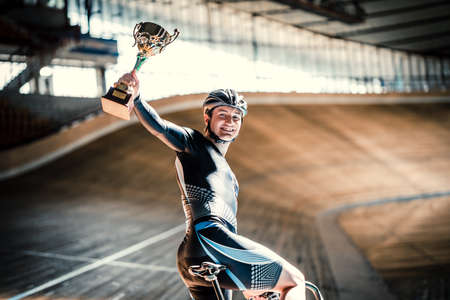 Happy athlete on velodromeの写真素材